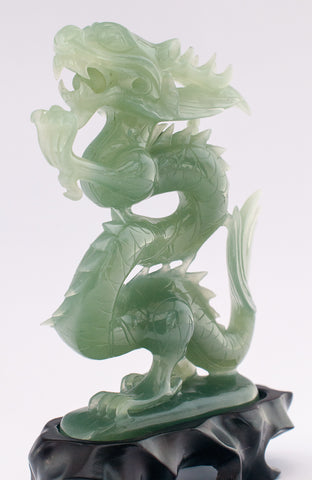 A superb carved green jade Dragon with loose carved ball in its mouth ...